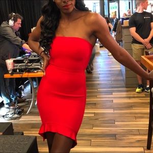 Red, body sculpting strapless dress.